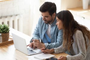 Couple planning on computer